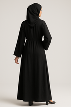 Professional studio photo of woman in abaya - back view